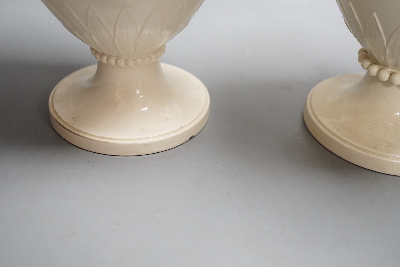 A pair of Wedgwood Etruria creamware vases and covers, c.1900, 28cm tall